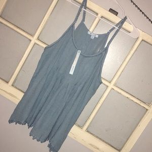 Boutique blue tank with derailed trim